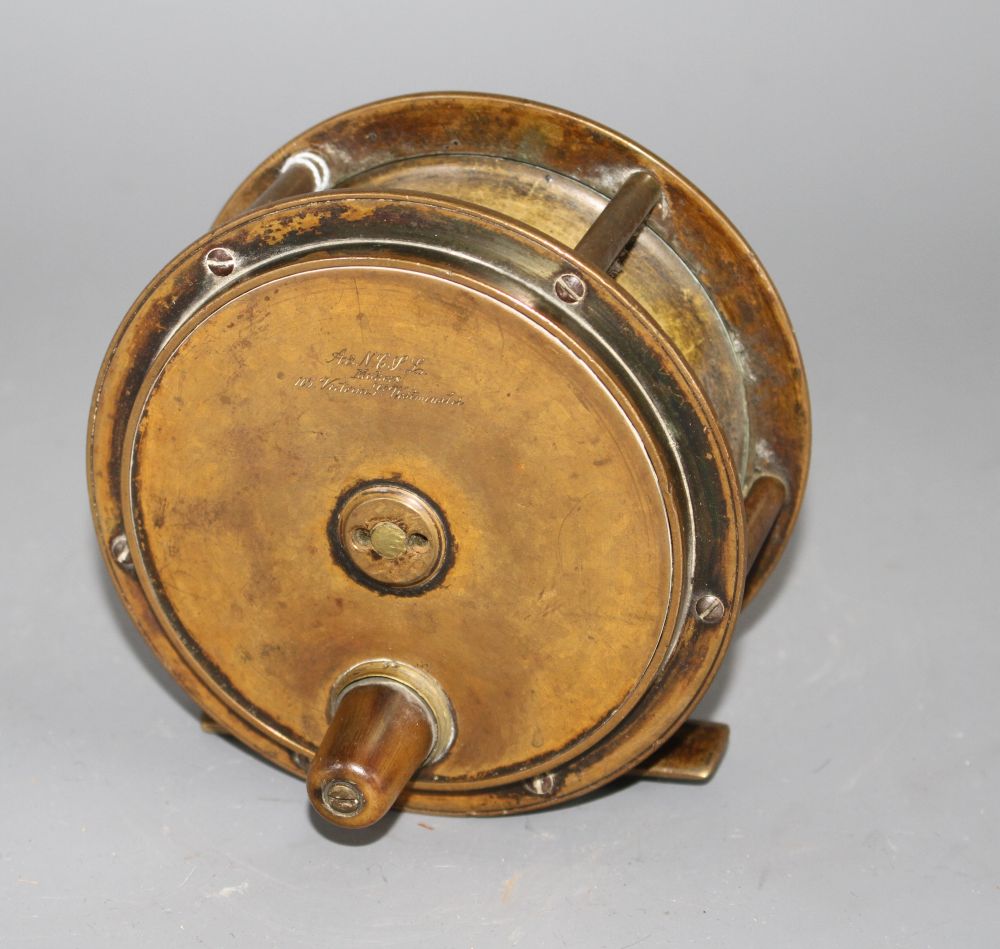 An early brass 4.5in. fishing reel by Army & Navy Cooperative Stores Ltd., engraved mark, diameter 11.5in., with horn handle